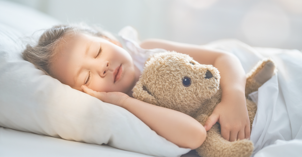 Baby sleeping in crib, sunlight streaming on her face
